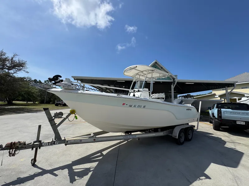 Slide: The Image of 2011 Sea Fox 236 Center Console boat on trailer under clear blue sky. - 3