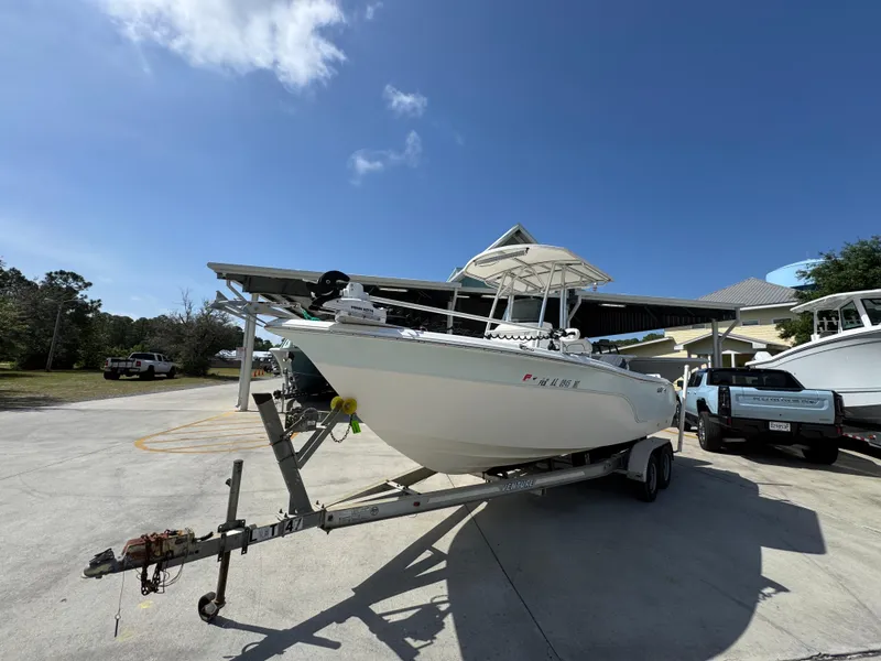 Slide: The Image of 2011 Sea Fox 236 Center Console boat on trailer under clear blue sky. - 4