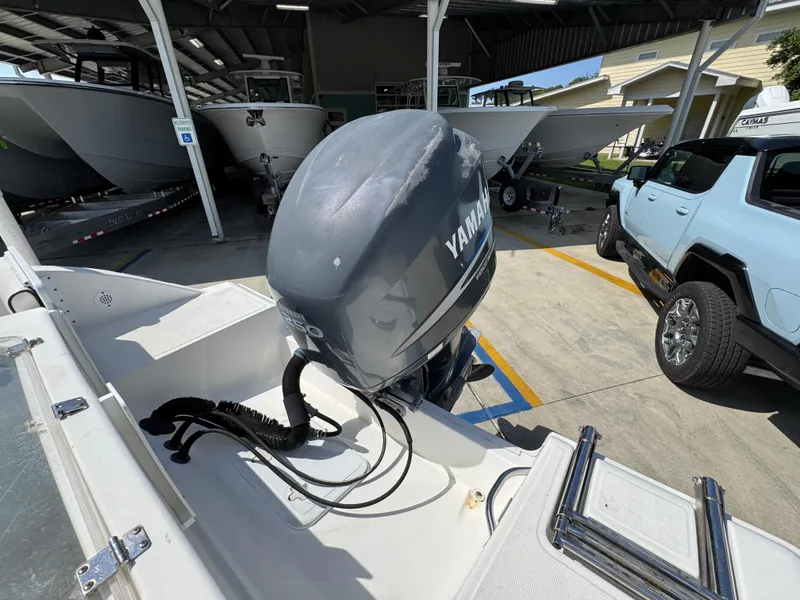 Slide: The Image of 2011 Sea Fox 236 Center Console with Yamaha outboard motor in a boat storage area. - 41