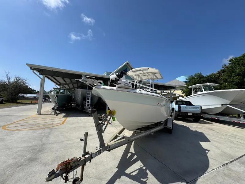 Slide: The Image of 2011 Sea Fox 236 Center Console boat on trailer under clear blue sky. - 5