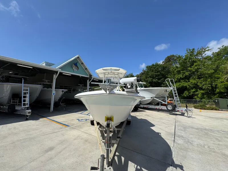 Slide: The Image of 2011 Sea Fox 236 Center Console boat on trailer under clear blue sky. - 7