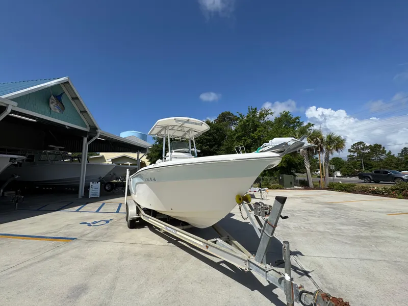 Slide: The Image of 2011 Sea Fox 236 Center Console boat on trailer under clear blue sky. - 8