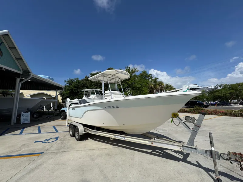 Slide: The Image of 2011 Sea Fox 236 Center Console boat on trailer under clear blue sky. - 9