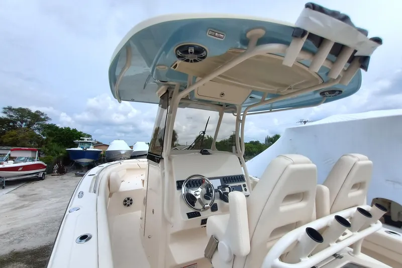 Slide: The Image of 2025 Grady-White Canyon 271 boat interior with helm and seating area. - 11