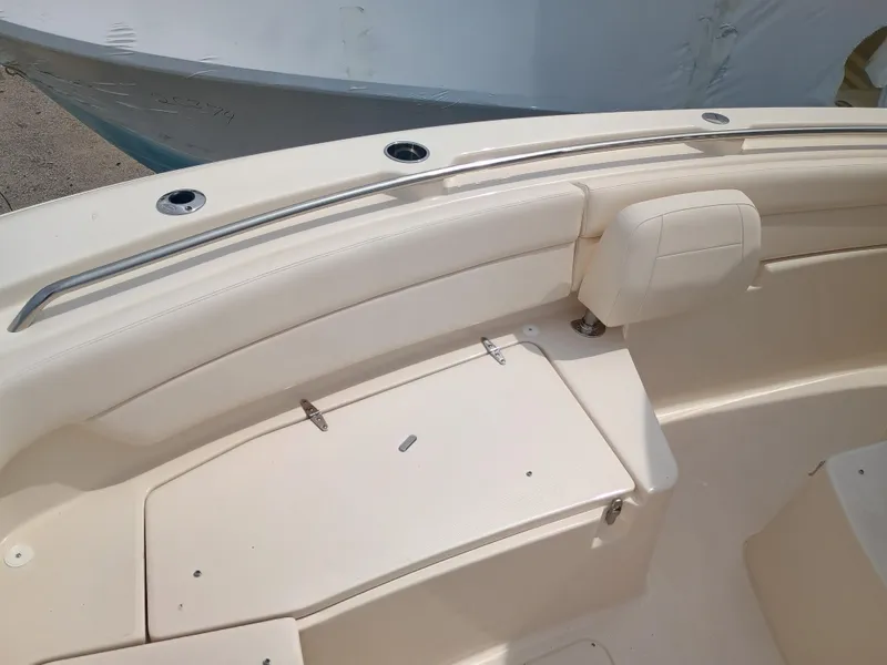 Slide: The Image of 2025 Grady-White Canyon 271 boat interior, featuring seating and storage compartments. - 19
