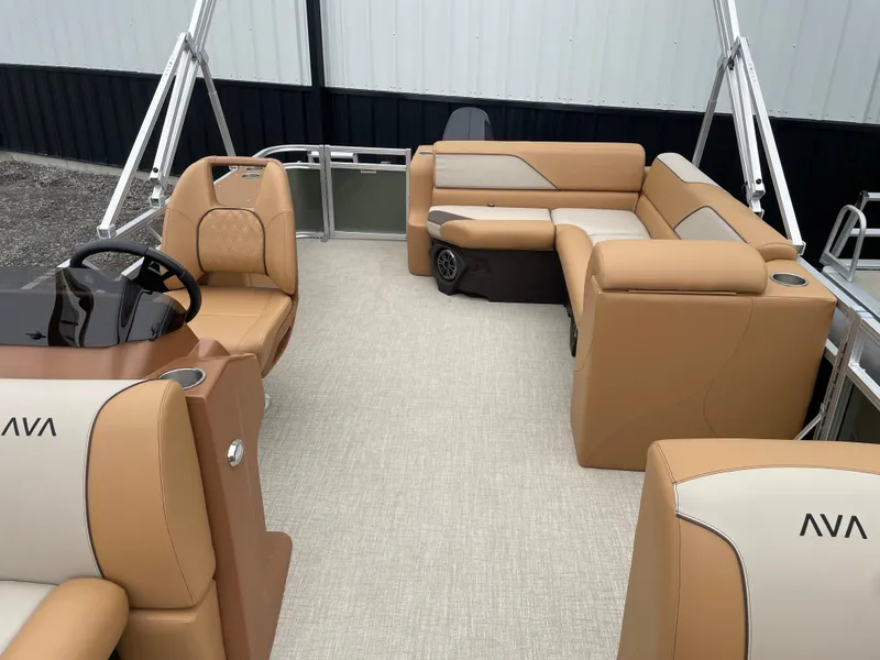 Slide: The Image of 2025 Tahoe Pontoon 2185 CRB interior with tan seating and modern design. - 15