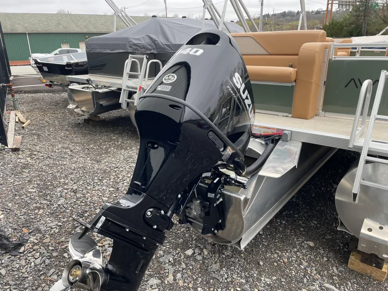 Slide: The Image of 2025 Tahoe Pontoon 2185 CRB with tan seating and modern design. - 3