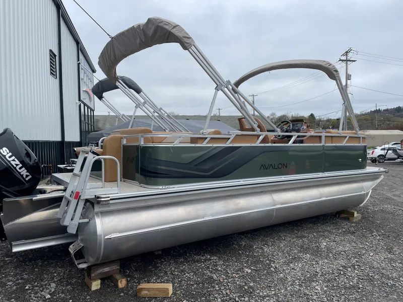 Slide: The Image of 2025 Tahoe Pontoon 2185 CRB with Suzuki engine, parked outdoors. - 5