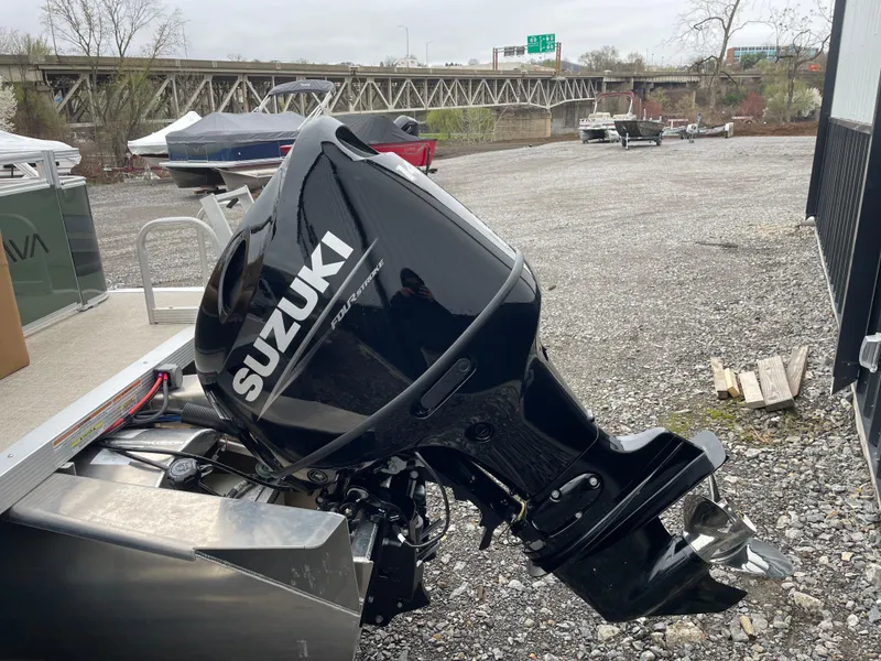 Slide: The Image of 2025 Tahoe Pontoon 2185 CRB interior with tan seating and modern steering console. - 7