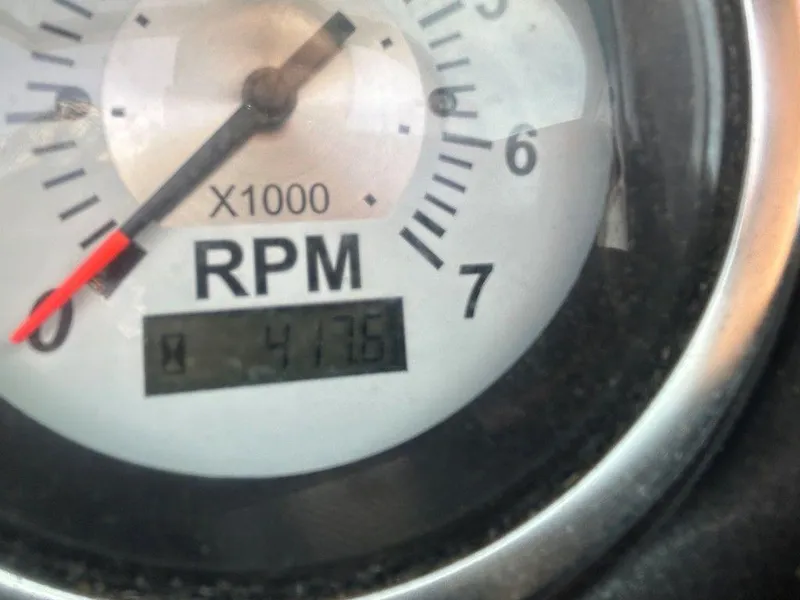 Slide: The Image of Close-up of a 2013 Crownline 21 SS tachometer showing 4176 RPM. - 13
