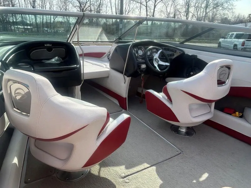 Slide: The Image of Interior of a 2013 Crownline 21 SS boat with white and red seating. - 14