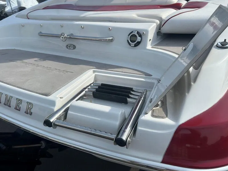 Slide: The Image of 2013 Crownline 21 SS boat with extended swim platform and retractable ladder. - 24