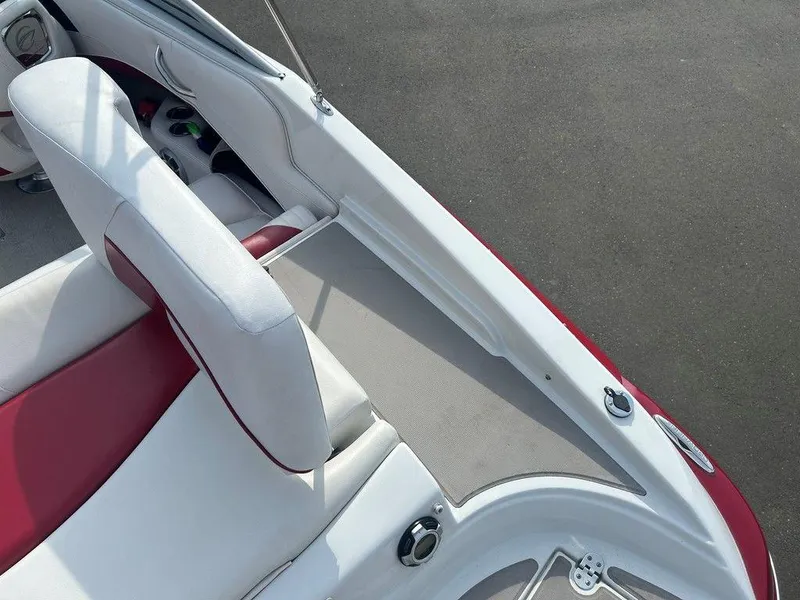 Slide: The Image of 2013 Crownline 21 SS boat interior with red and white seating, sleek design. - 25