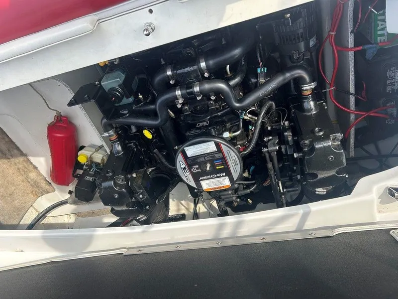 Slide: The Image of Engine compartment of a 2013 Crownline 21 SS boat, featuring detailed mechanical components. - 26