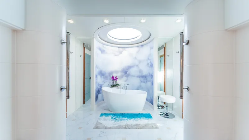 Slide: The Image of Luxurious yacht bathroom with freestanding tub, modern design, and elegant decor on Feadship TASIA. - 13