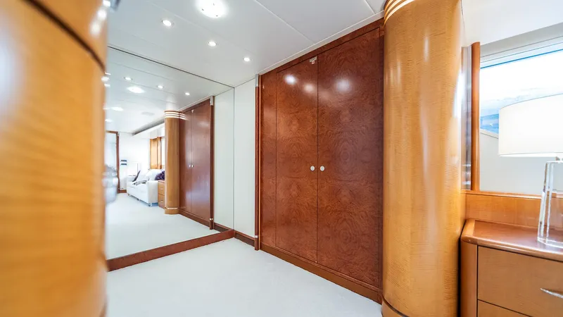 Slide: The Image of Luxurious interior of 1997 Feadship TASIA yacht with elegant wood paneling and modern lighting. - 17