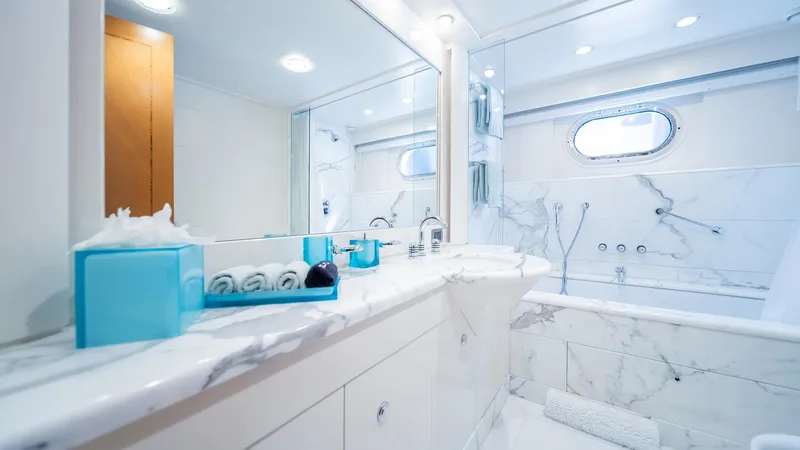 Slide: The Image of Luxurious yacht bathroom with marble decor on Feadship TASIA, 1997 model. - 23