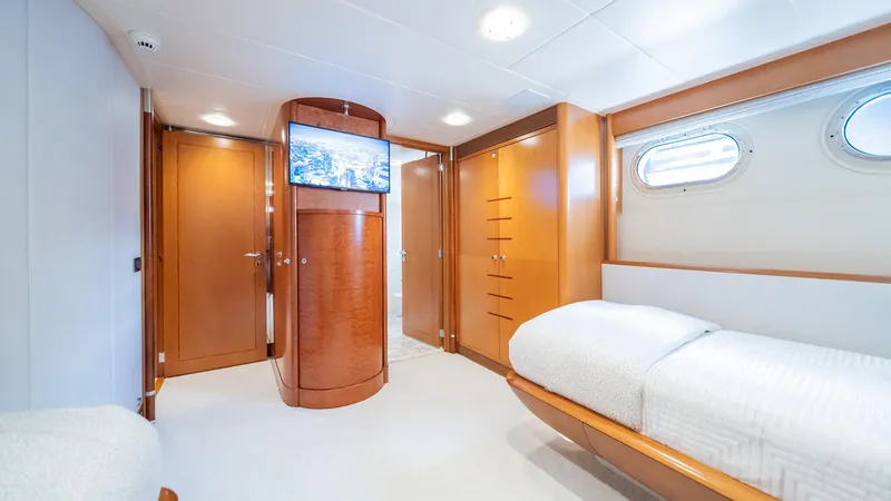 Slide: The Image of Luxurious cabin interior of 1997 Feadship TASIA yacht with twin beds and wooden furnishings. - 24