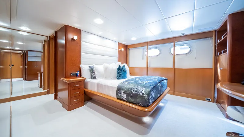 Slide: The Image of Luxurious bedroom interior on 1997 Feadship TASIA yacht with elegant wood finishes. - 35