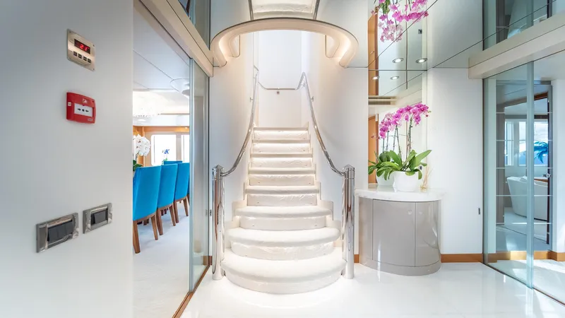 Slide: The Image of Luxurious interior of 1997 Feadship TASIA yacht with elegant staircase and modern decor. - 39