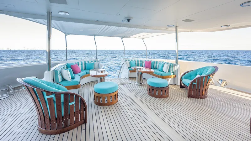 Slide: The Image of Luxurious deck seating on 1997 Feadship TASIA yacht with ocean view. - 45