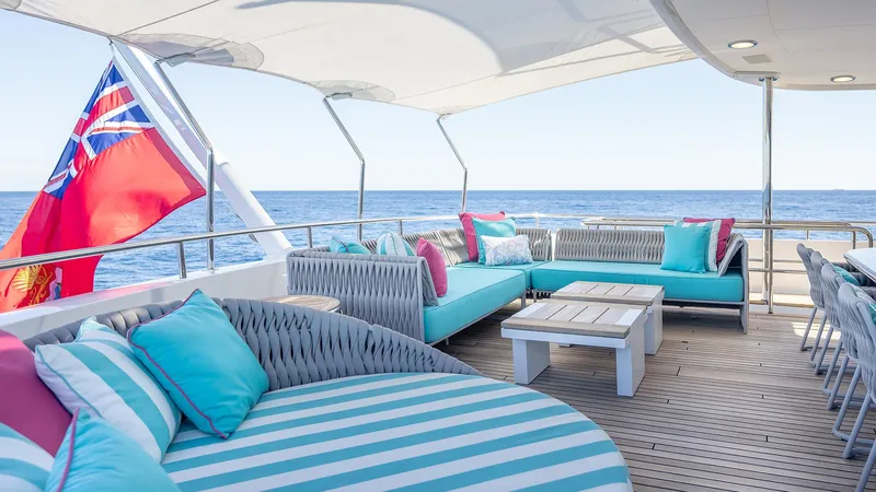 Slide: The Image of Luxurious 1997 Feadship TASIA yacht deck with stylish seating and ocean view. - 46