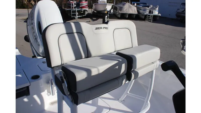 Slide: The Image of 2025 Sea Pro 230 Bay boat seating with white and gray cushions. - 4