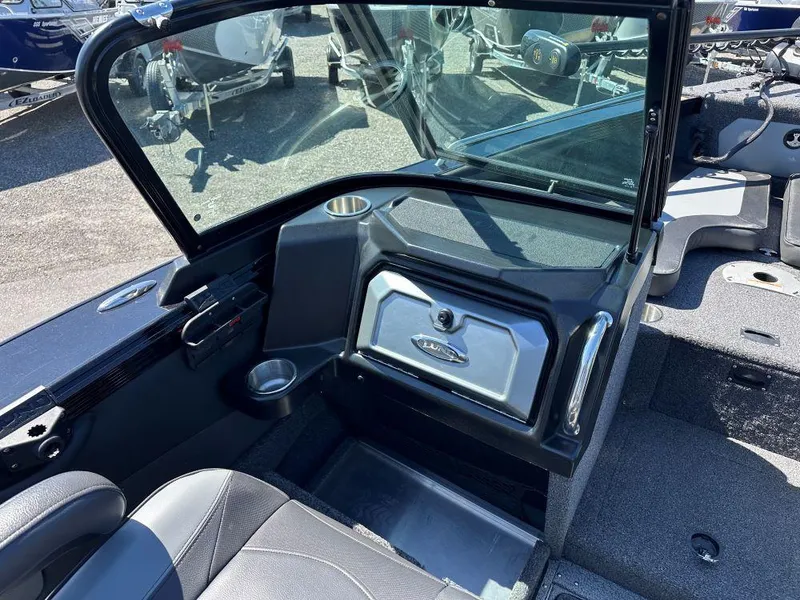 Slide: The Image of 2020 Lund 1875 Tyee boat interior with windshield and seating area. - 8