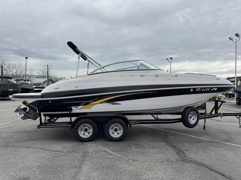 Slide: The Image of 2007 Four Winns 224 Funship boat on trailer in parking lot. - 6