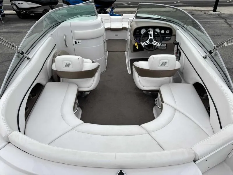 Slide: The Image of 2007 Four Winns 224 Funship boat interior with white seating and steering console. - 9