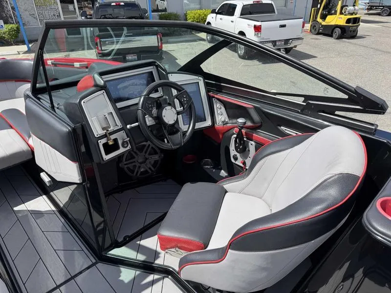 Slide: The Image of 2019 Supra SE550 boat interior with modern dashboard and steering wheel. - 10