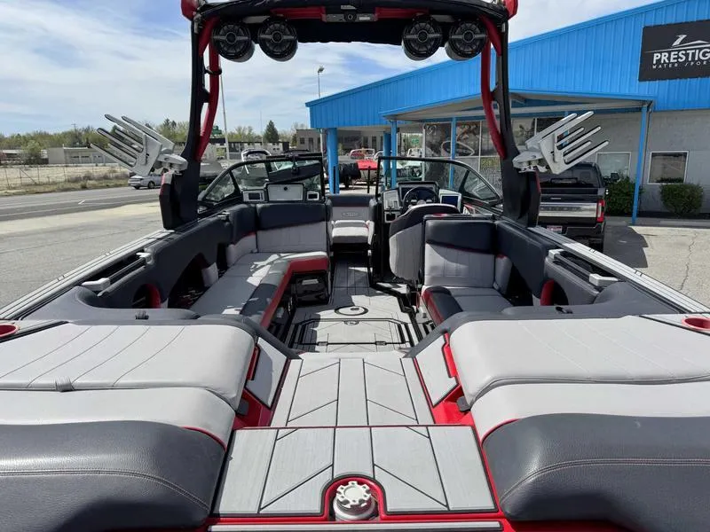 Slide: The Image of 2019 Supra SE550 boat interior with spacious seating and modern design at a dealership. - 6