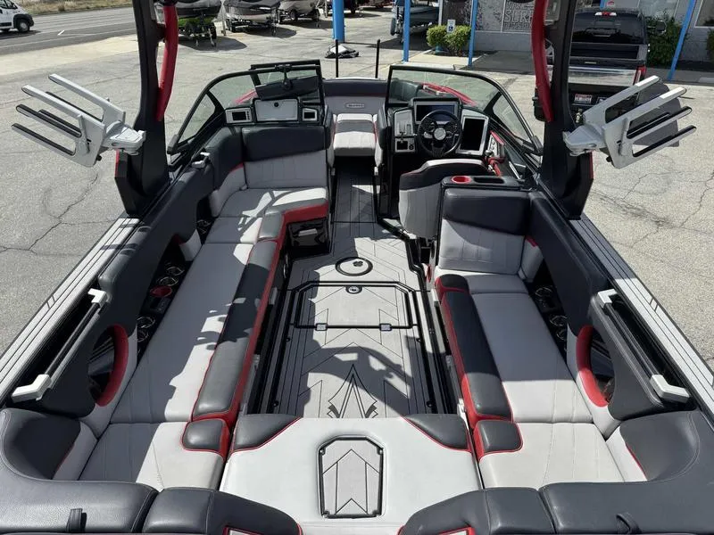 Slide: The Image of 2019 Supra SE550 boat interior with spacious seating and modern dashboard. - 8