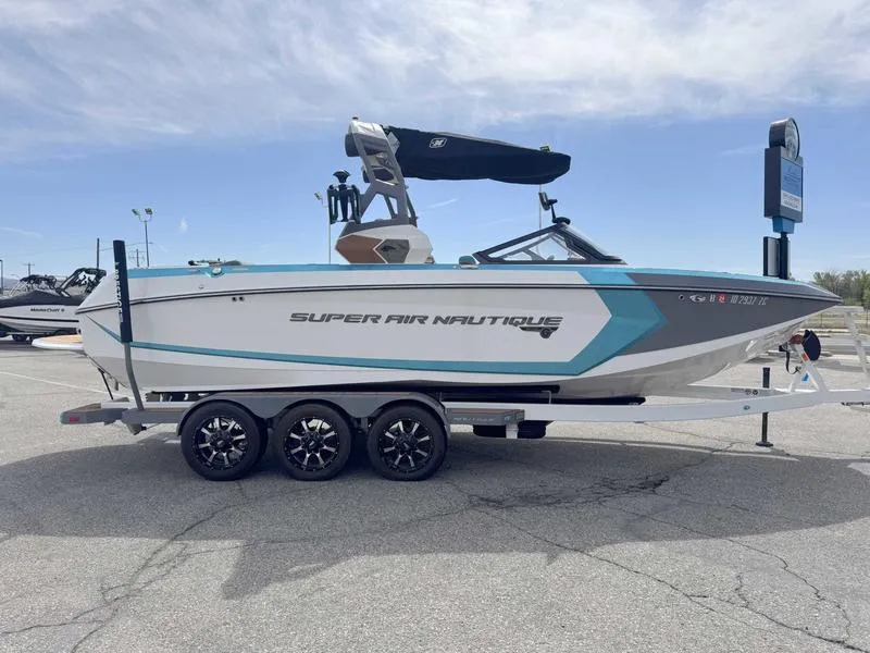 Slide: The Image of 2019 Nautique G25 boat with trailer, featuring sleek design and modern amenities. - 5