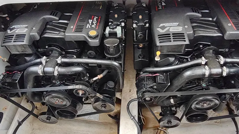 Slide: The Image of Twin Mercury V8 engines in a 2000 Formula 31PC boat. - 14