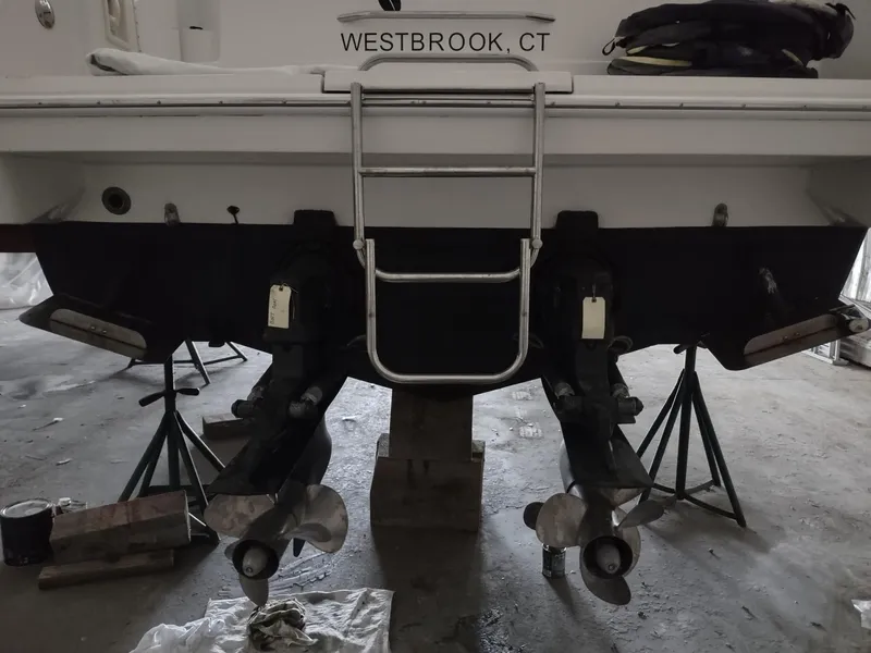 Slide: The Image of Rear view of a 2000 Formula 31PC boat with dual propellers, ladder, and "Westbrook, CT" label. - 4