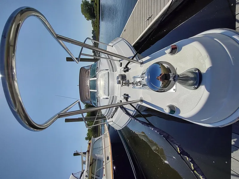 Slide: The Image of 2000 Formula 31PC boat docked, featuring sleek design and polished metal railings. - 5