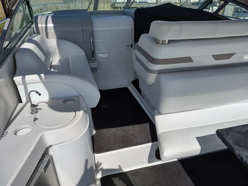 Slide: The Image of Interior of a 2000 Formula 31PC boat with white seating and compact sink. - 7