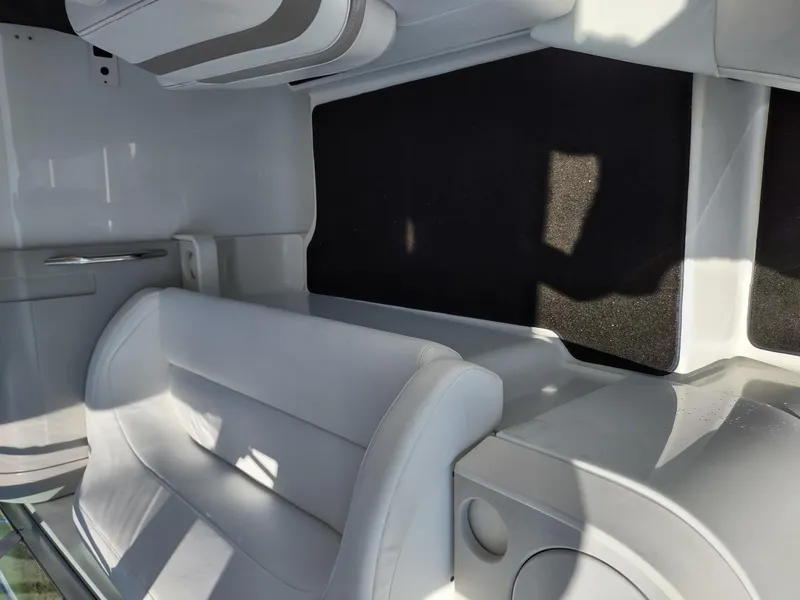 Slide: The Image of Interior of a 2000 Formula 31PC boat with white seating and sleek design. - 9