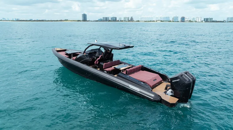 Slide: The Image of 2023 Skipper-BSK 42NC boat on open water, featuring sleek design and modern amenities. - 10