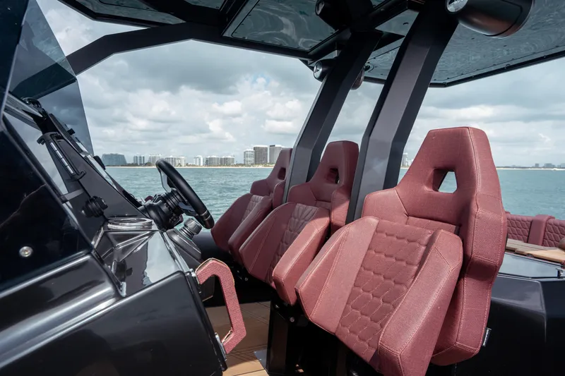 Slide: The Image of Luxurious interior of 2023 Skipper-BSK 42NC boat with red seats and modern design. - 13