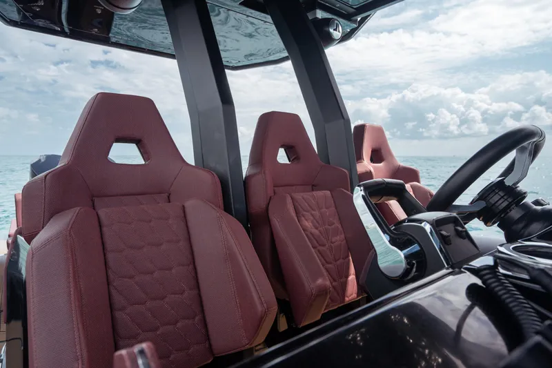 Slide: The Image of Luxurious Skipper-BSK 42NC boat interior with red seats, 2023 model, ocean view. - 14