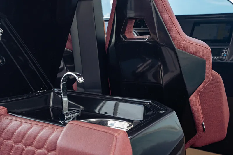 Slide: The Image of Luxury interior of 2023 Skipper-BSK 42NC boat with sleek sink and maroon seating. - 15