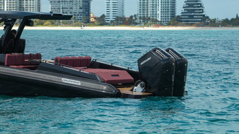 Slide: The Image of Skipper-BSK 42NC 2023 boat with dual Mercury engines on blue water near city skyline. - 18