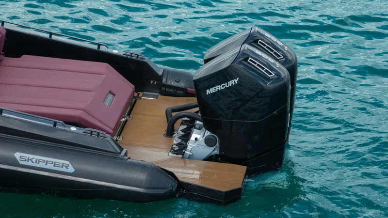 Slide: The Image of Skipper-BSK 42NC boat with Mercury engines on blue water, 2023 model. - 19