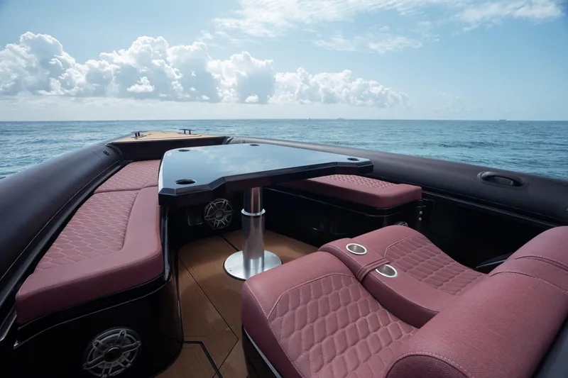 Slide: The Image of Luxurious Skipper-BSK 42NC boat interior with red seating, ocean view, 2023 model. - 2
