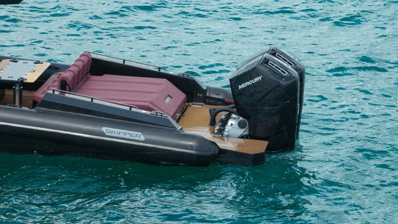 Slide: The Image of Skipper-BSK 42NC 2023 boat with Mercury engine on turquoise water. - 20