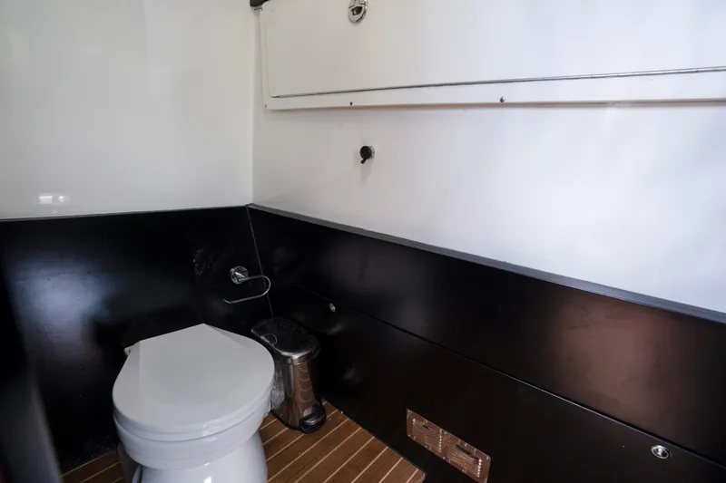 Slide: The Image of Modern boat bathroom interior, Skipper-BSK 42NC 2023, featuring sleek design and wooden flooring. - 5