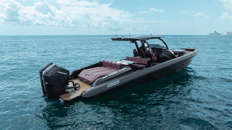 Slide: The Image of 2023 Skipper-BSK 42NC boat on open water, featuring sleek design and powerful engines. - 9