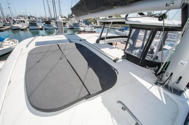 Slide: The Image of 2017 Lagoon 42 catamaran deck view in marina, showcasing sleek design and spacious layout. - 21